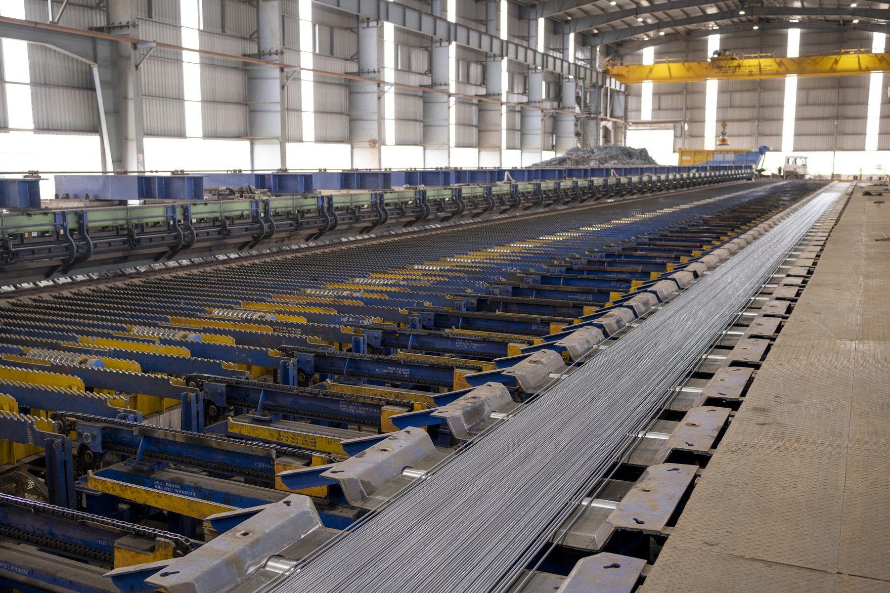 Finished ribbed bars on the cooling bed conveyor